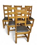 A set of six contemporary oak kitchen chairs, ladder backs, drop in seats, 105cm high, 43cm wide