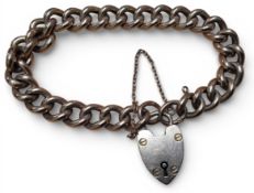 A 9ct rose gold hollow curb link/charm bracelet, 9ct gold heart shaped padlock, each link stamped