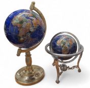 A specimen stone terrestrial desk globe, meridian ring and stand, 20cms high; another 31cms high (