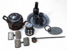 A white metal wirework and ceramic thimble, the crown hand painted with a face; a pair of gold on