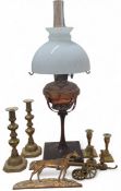 A copper paraffin oil lamp, supported by slender wooden base; a Victorian brass plaque of the