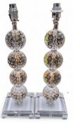 Lighting - a pair of contemporary glass lamp side lights, the columns with  four dimpled spheres,