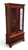 A 20th century yew display cabinet, inlaid with bat wing patera,  moulded cornice two glazed