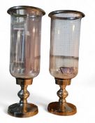 A pair of large  contemporary glass and chrome hurricane lamps, 59cms tall