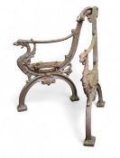 A pair of Victorian cast iron bench ends, the scroll ends cast with furious dragons, 72cm high, 49.