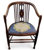 An Edwardian mahogany satinwood strung salon chair, tapestry seat, double stretchers, cylindrical