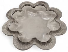 A Lalique scalloped clear glass bowl, the rim in relief with stiff leaves, 28cm wide, etched mark