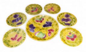 A set of seven Sarraguemines majolica plates,  the large plate in relief with strawberries,
