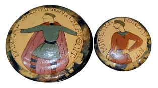 A 'Bayeux Tapestry' compressed circular pot and cover, the covers with stylised figures, 18cm