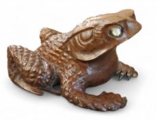A Japanese hardwood okimono frog/toad, abalone eyes, 6cm high, seal mark