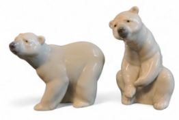 A Lladro polar bear, walking, 10cm high, printed mark;  another, seated (2)