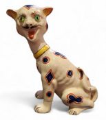 A 19th century French Masonic faience pottery cat, with applied green eyes, laughing, painted with