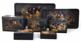 A set of five Chinese graduated papier mache rectangular boxes, each in gilt picked out in red and