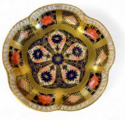 A Royal Crown Derby 1128 petal shaped trinket dish, gold banded borders, 11cm diam, printed mark
