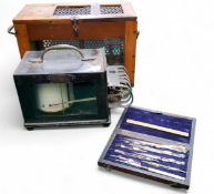 A Negretti and Zambra barograph/ thermograph. glazed and mahogany case, 32cm wide;  a geometry