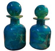 A pair of Mdina blue glass studio glass scent bottles, with ochre mottling, with conforming globular