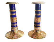 A pair of Davenport Imari cylindrical candlesticks, 16cm high, crown mark, late 19th century