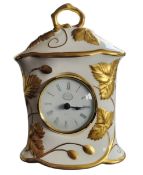 A Minton Victoria Strawberry pattern mantel clock, with circular dial, Roman numerals, 18cm high,