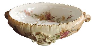 A Royal Worcester two handled bowl, in relief with leafy scrolls, printed and painted with summer