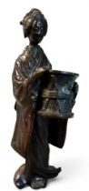Japanese School, late Meiji, brown patinated bronze, Geisha, holding a drum, 18cm high