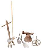 An early 19th century cast iron bell, lacking clanger, 36cm high (rusty);  a pit shovel and axe;   a