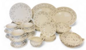 A Wedgwood April Flowers dinner service, for six, comprising soup bowls and stands, dinner,