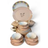 A Poole Leaping Deer dinner service, each with stylised deer and foliage on a pink ground,
