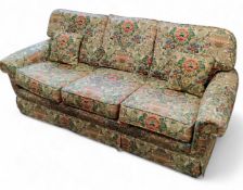 A Peter Guild three seater settee, modern, upholstered in Sanderson's Cascaca, with floral