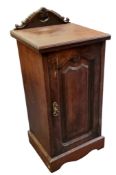 A Victorian pot cupboard, scroll back, panelled door, plinth base, 88cm high, 41cm wide, 38cm