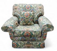 A Peter Guild armchair, modern, upholstered in Sanderson's Cascaca, with floral bouquets in ornate