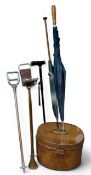 A 19th century galvanised tin brown painted oval top hat box, hinged cover, swing handle, 29cm high;