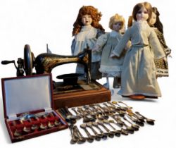 A singer sewing machine;   collector's spoons;    four collector's dolls; etc