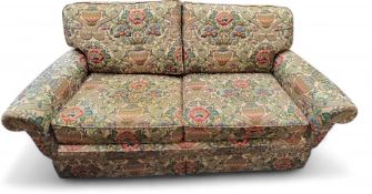 A Peter Guild two-seater settee, modern, upholstered in Sanderson's Cascaca, with floral bouquets in