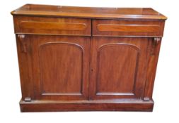 A Victorian mahogany side cabinet, rounded rectangular top, above two drawers and arched fielded