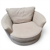 A DFS Russo swivel chair, rotating 360 degrees, in ocra, 130cm wide, 120cm deep