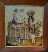 A Victorian woolwork, embroidered with a family and their dog, 43cm x 39cm, maple frame