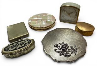 A Regent of London circular compact mounted with mother of pearl to cover; a Stratton shaped