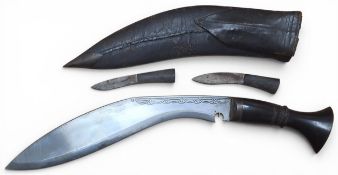 A Nepalese kukri with a curved steel blade and hardwood grip, leather scabbard with sharpening steel