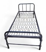 A Victorian cast iron bed frame, possibly a prison/hospital bed, painted black, 84cm high, 93cm