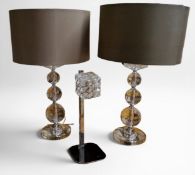 A pair of contemporary side lights, the columns from three graduated prismatic spheres, buff shades,