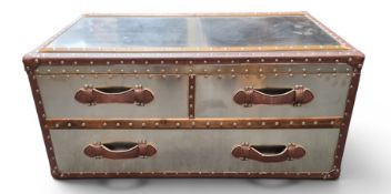 A Timothy Oulton style designer 'steamer trunk' low chest,  of brushed steel, studded,  with tan