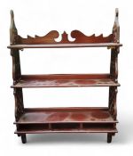 A set of mahogany wall hanging shelves, pierced sides, 92cm high, 66cm wide