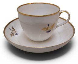 A Pinxton Bute teacup and saucer, pattern no.46, decorated with cornflowers and gilt sprigs, gilt