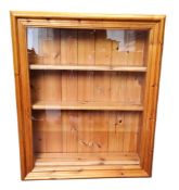A pine rectangular wall hanging glazed display cabinet, 80cm high, 67cm wide
