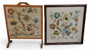 An early 20th century oak fire screen, embroidered with Tree of Life, deer and bird, 66cm high, 51cm