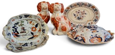 A pair of Staffordshire dogs, seated to the left and right, rust coat markings, 26cm high, c.1880;