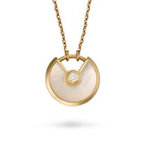 CARTIER, A MOTHER OF PEARL AND DIAMOND AMULETTE DE CARTIER NECKLACE in 18ct yellow gold, the