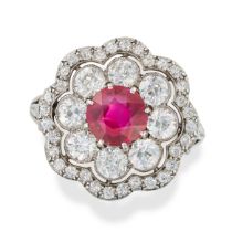 AN IMPORTANT BURMA NO HEAT RUBY AND DIAMOND DRESS RING set with a round cut ruby of approximately