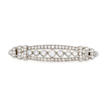 A DIAMOND BROOCH,1930'S in platinum and white gold, the elongated oval body set with a row of