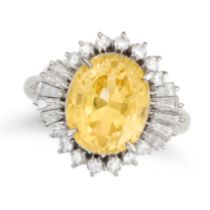 AN UNHEATED YELLOW SAPPHIRE AND DIAMOND RING set with an oval cut yellow sapphire of 5.14 carats